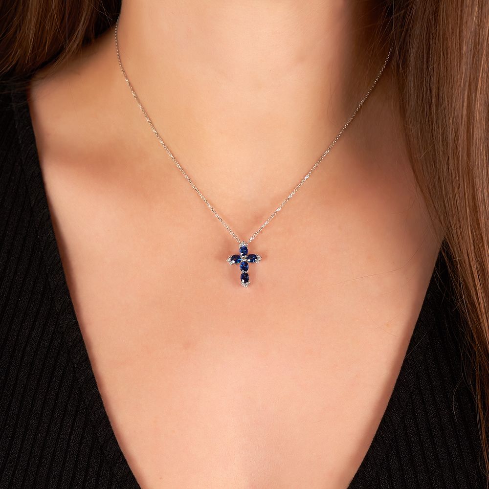 Small Oval Sapphire and Round Diamond Cross Pendant in 18K White Gold
